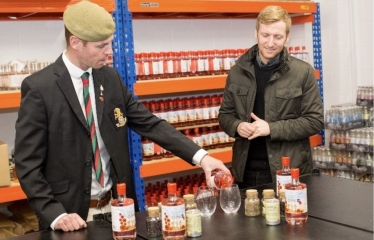 Lee Rowley at distillery looking at British Legion Gin