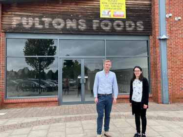 Lee with Cllr Charlotte Cupit outside Fultons Foods